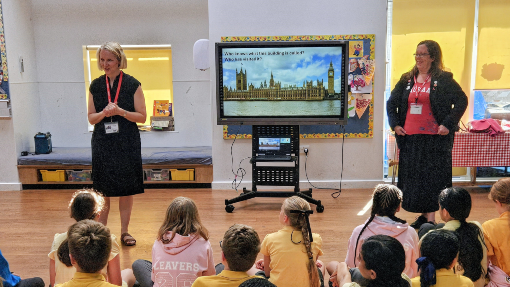 Emma Reynolds MP talking to school children from Downley school in Wycombe. Cllr Hazel Arthur Hewitt also photographed.
