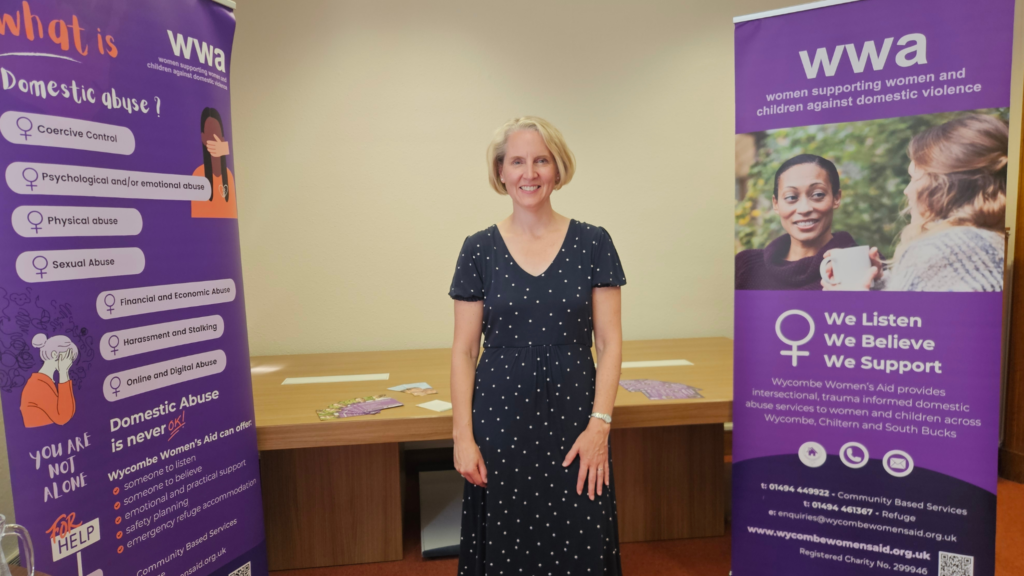 Emma Reynolds infront of Wycombe Women's Aid.